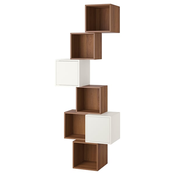 An ikea EKET wall-mounted shelving unit with alternating brown and white cubed compartments in a diagonal arrangement.