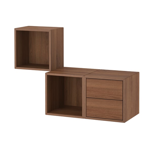 An EKET wall-mounted storage unit in walnut colour. It both open and closed sections, combining cubes and drawers for versatile storage.