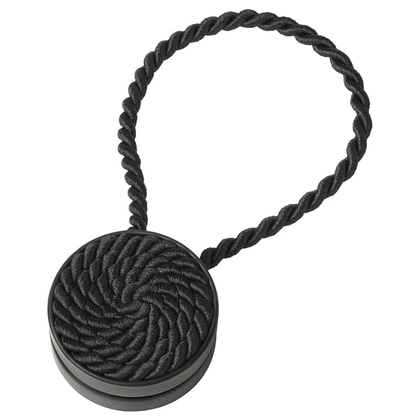 Black magnetic curtain tie-back, rope-like design with circular magnetic ends, decorative and practical.