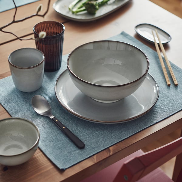 GLADELIG grey bowl, stoneware, large round shape with sand-glazed surface,chet on blue mat, perfect for ramen, soup.