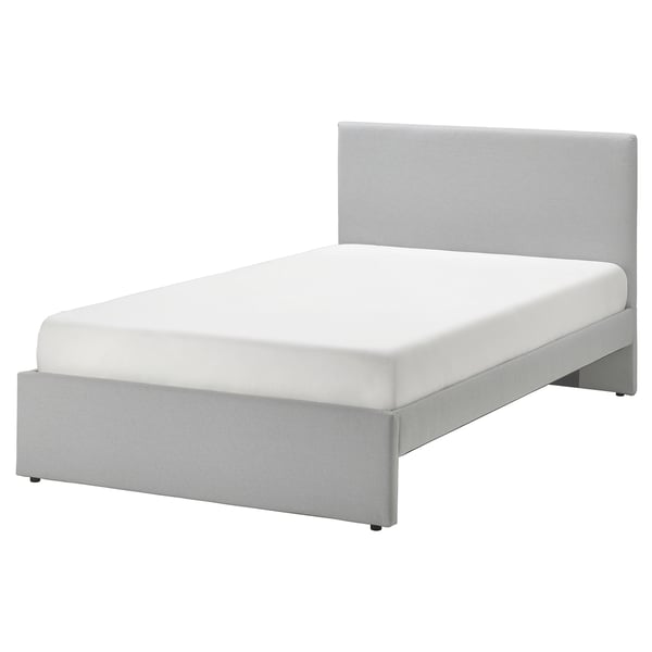 A GLADSTAD bed with a grey, padded headboard and matching base, featuring a modern design.