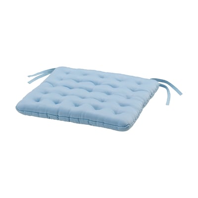 Light blue rectangular seat cushion with tufted design & ties for securing.