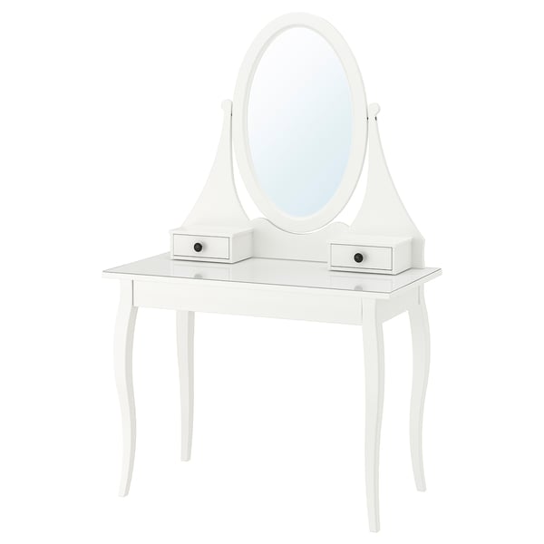 A white HEMNES vanity with glass top, featuring an oval mirror and three drawers.