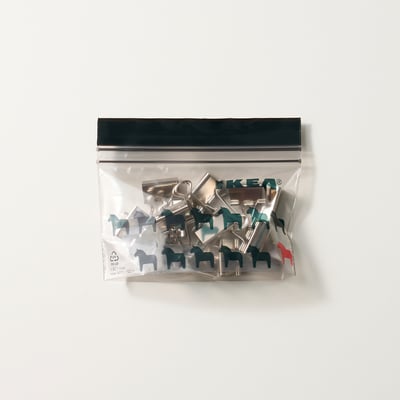 Clear resealable bag with colourful metallic clips shaped like horses, ideal for organising small items.