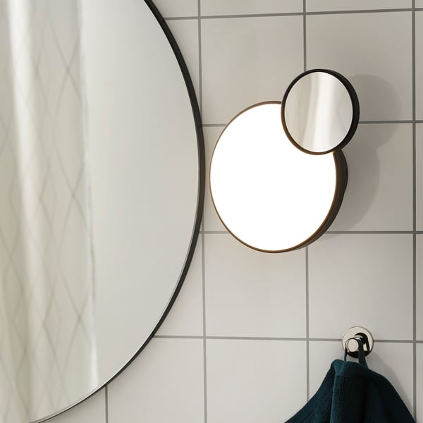 Unique wall lamp with mirror magnifies reflection, ideal for makeup or shaving. Built-in led dimmable light for varied atmosphere.