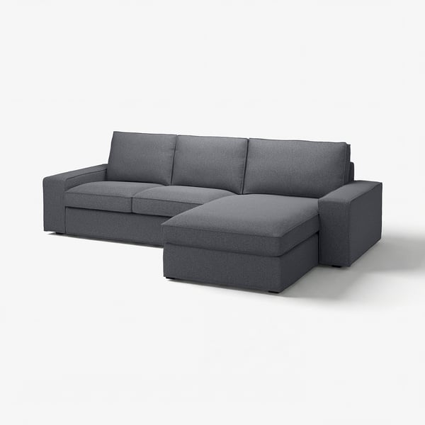Modern grey sectional sofa with chaise, low armrests, and cosy cushions.
