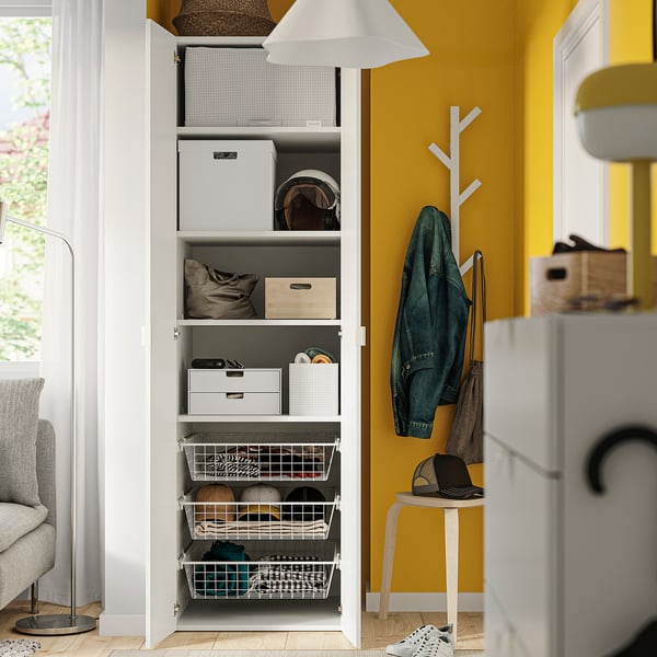 Well-organized closet with shelves, storage bins, and hanging coat tree.