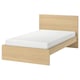 MALM light oak wood bed with white mattress, rectangular, minimalist.