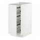 A white METOD kitchen cabinet with pull-out wire baskets for storage.