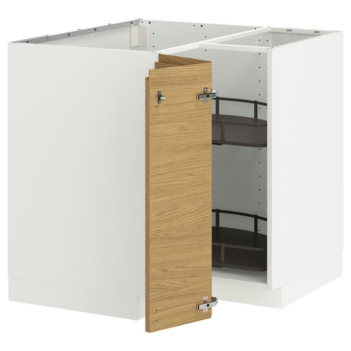 A white ikea METOD kitchen unit with an oak-effect door thats slightly open.