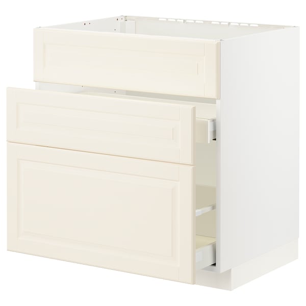 An off-white METOD kitchen cabinet with bevelled edges, featuring a structured design and smooth-running drawers.