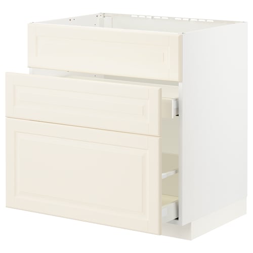 An off-white METOD kitchen cabinet with bevelled edges, featuring a structured design and smooth-running drawers.