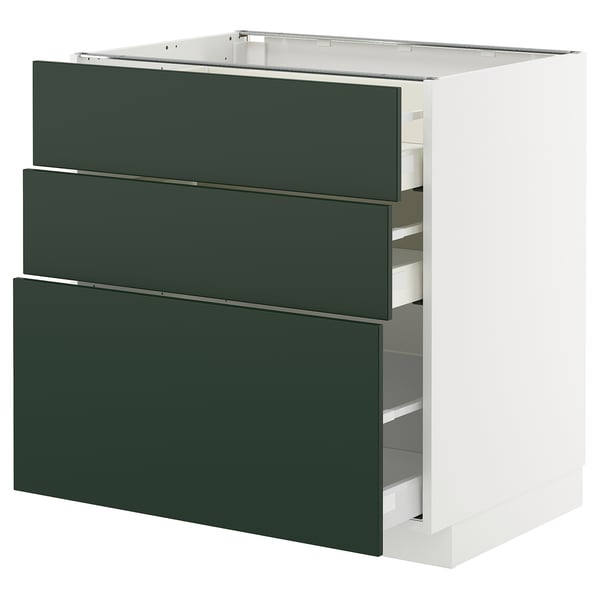 Modern green kitchen cabinet with three drawers. Sleek, high-quality design, white frame. Full-extension drawers, deep green fronts.