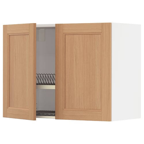 A wall-mounted kitchen cabinet named METOD with oak doors and a steel dish drainer inside.