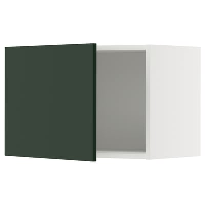 A green METOD kitchen cabinet with a white interior.