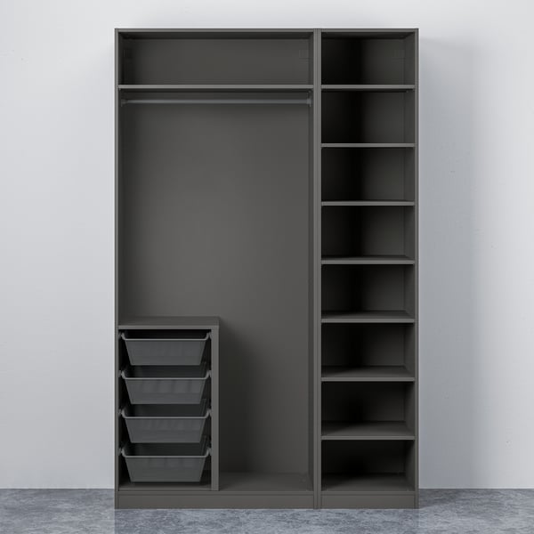 Open PAX wardrobe: dark interior, drawers, shelves, hanging rod.