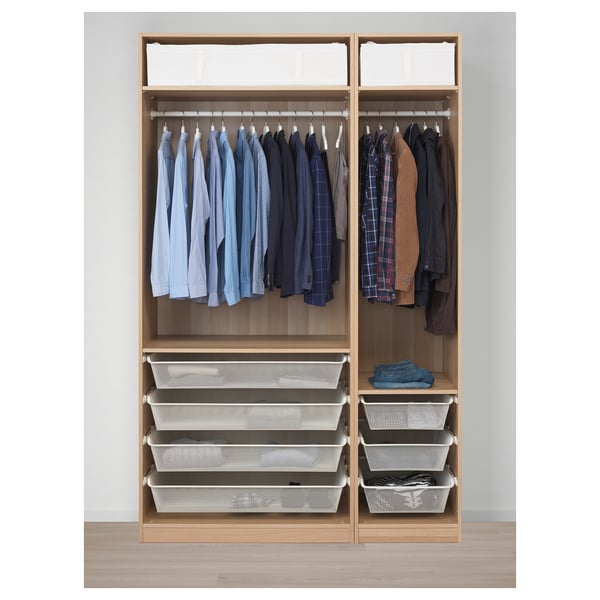 Wooden wardrobe with hanging shirts and jackets, shelves, and storage baskets.