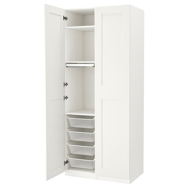 White PAX wardrobe, open showing shelves, baskets, and trouser hanger.