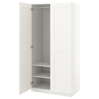A white ikea PAX wardrobe with one door open, revealing adjustable shelves inside.