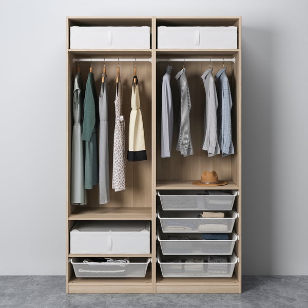 Organised closet with hangers, shelves, and drawers. Clothes and accessories neatly stored with adjustable, sliding doors.