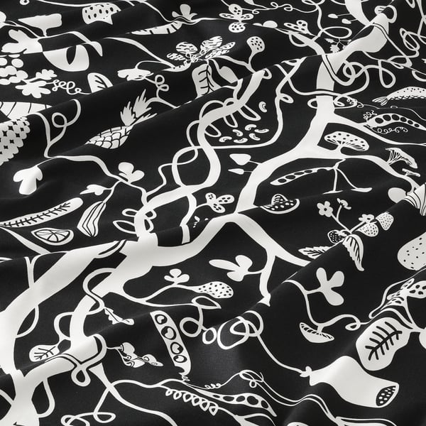 Black and white patterned fabric with playful food designs. High quality, intricate details, ideal for crafting.