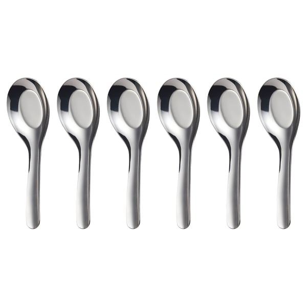 Six shiny, stainless steel spoons with sleek, polished design laid side by side.