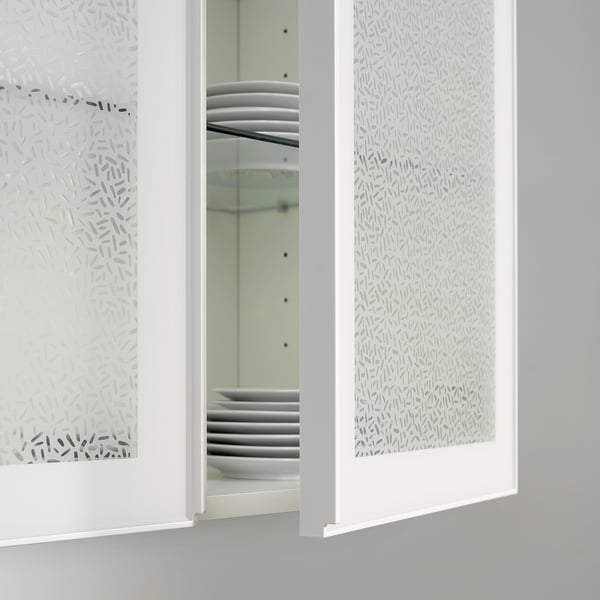 White PUCKELFLY window film covers large glass panels, offering privacy with a patterned design.