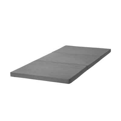 Foldable grey mattress on white background, ideal for easy storage.