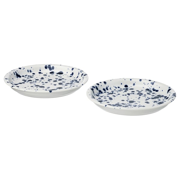 Two white plates with blue speckles, round shape, easy-grip edges, made of stoneware.