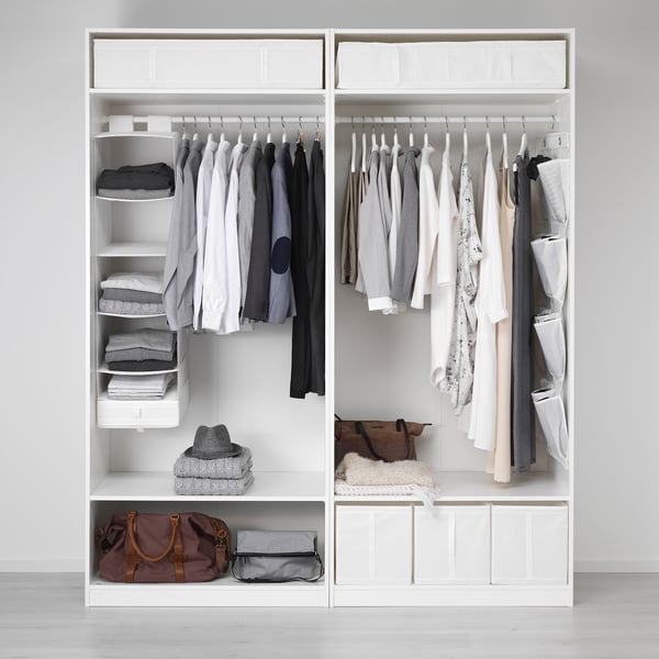 Organised wardrobe with clothes, accessories in SKUBB boxes, and drawers, maximising storage.