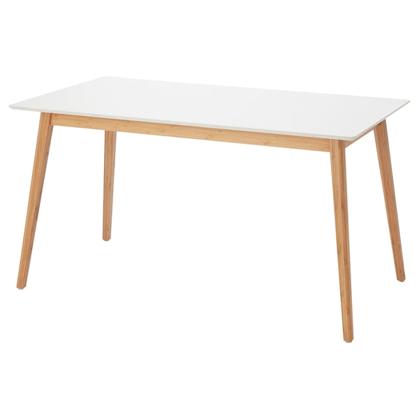 Depicts a STENARED table with a white quartz top and light wooden legs. It a rectangular shape and clean, modern design.