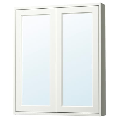 A TÄNNFORSEN white mirror cabinet with bevelled panels, offering storage and reflecting light to enhance bathroom space.