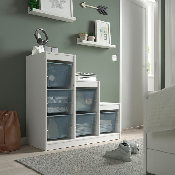 Multifunctional TROFAST storage unit in white, ideal for organising items. Mesh and solid shelves, suited to various spaces.