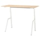 A trottén sit-stand desk in light oak colour with white legs. The desk a rectangular tabletop and adjustable metal legs for height variation.