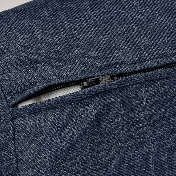 Dark blue woven fabric sofa-bed zip detail, showcasing quality texture and craftsmanship.