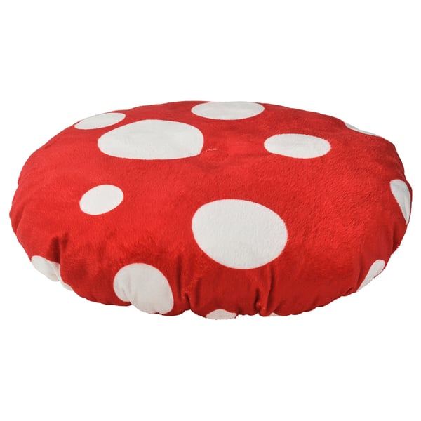 Rdeča, okrogla blazina z belimi pikami, namenjena otrokom.