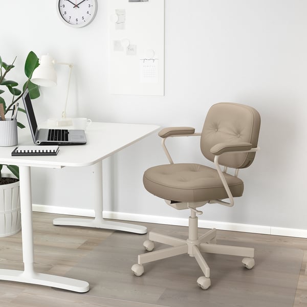 Modern home office: ALEFJÄLL chair, desk, laptop, coffee, plant, clock.