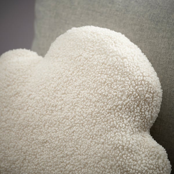 Fluffy cloud-shaped cushion, soft and inviting, made from recycled polyester, offering comfort and support.