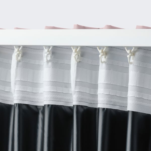 A curtain with hooks attached, designed to block out light.