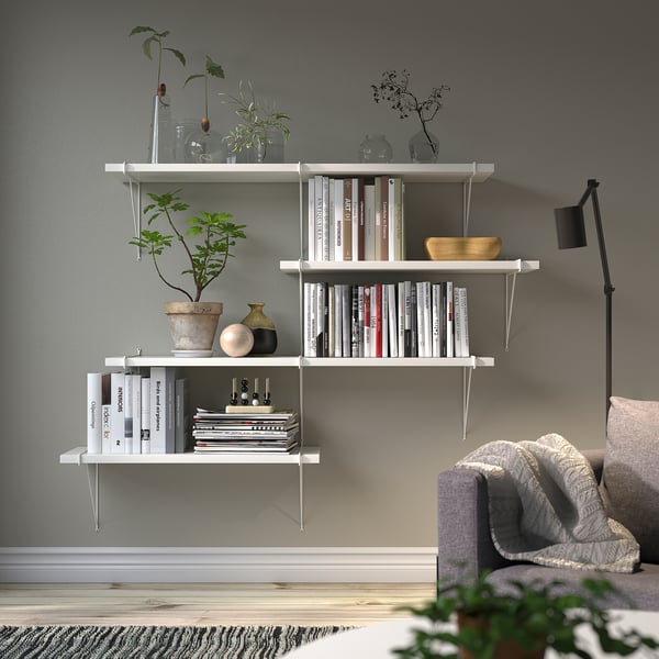 BERGSHULT wall shelf with books, plants, and brackets. Minimalist and elegant.