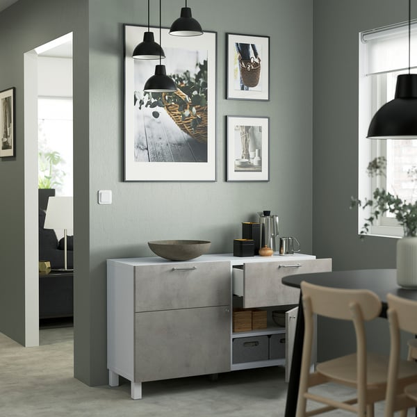 Modern dining, grey BESTÅ sideboard with adjustable shelves, bowl, decor, and pendant lights.