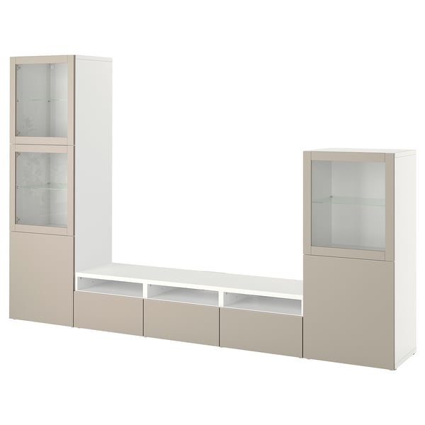 An off-white BESTÅ tv storage unit with glass doors and drawers. It has a modern, minimalist design.