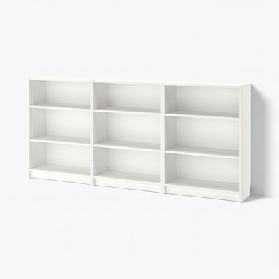 Three white BILLY bookcases with adjustable shelves, clean and minimalist design.