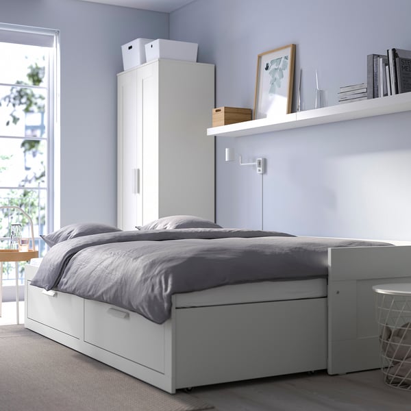 BRIMNES multifunctional day-bed with drawers & storage, converts to guest bed, grey bedding.