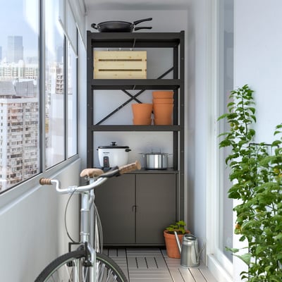 BROR storage unit with open & closed shelves, kitchen items, bike, windows, plant.