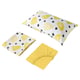 Three yellow patterned bed linens: one pillowcase, one folded flat sheet, and one fitted sheet laid out in a bright white background.