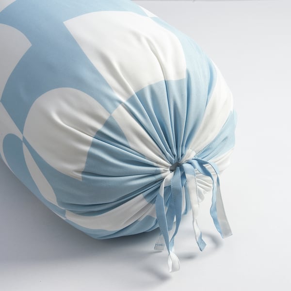 Light blue and white throw pillow tied with a bow, soft looking, sits against a white background.