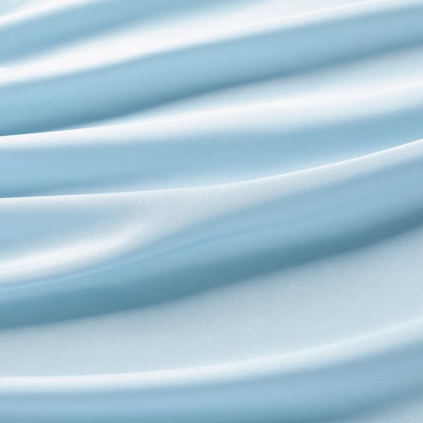 Close-up of soft, light blue fabric, showcasing smooth texture and quality.