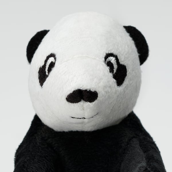 A soft, plush panda toy with black ears, eyes, and nose, made from recycled polyester.