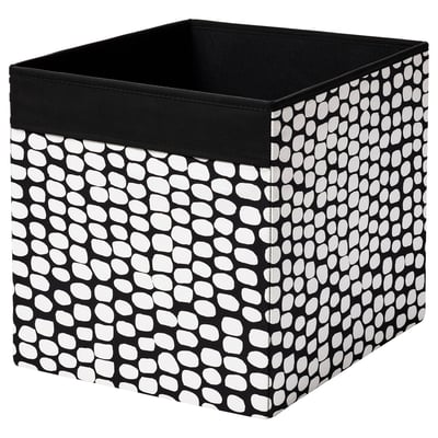 Black square DRÖNA storage box with white circular pattern, fabric material.